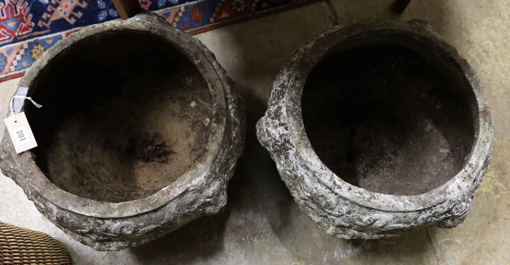 A pair of reconstituted stone garden planters, diameter 46cm, height 32cm